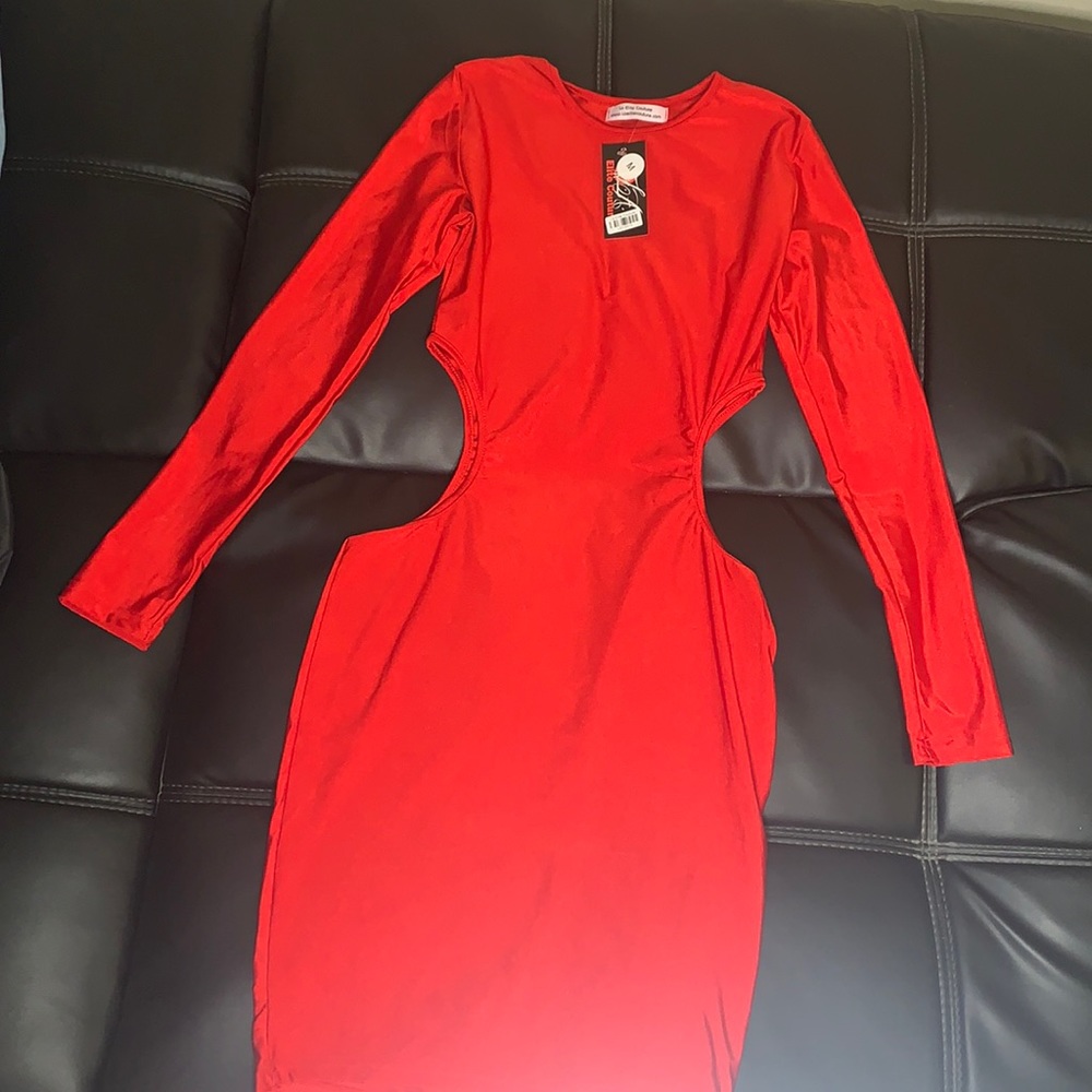 Red side cut out dress in a medium.